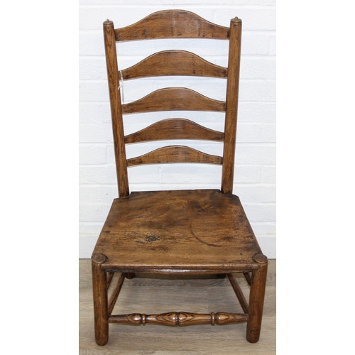 81 - An antique ladder-back low chair with elm seat, 90cm tall, and an Arts & Crafts period side chair wi... 