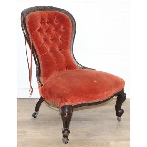74 - A 19th century low chair with shaped button back and exposed carved frame, 87cm tall