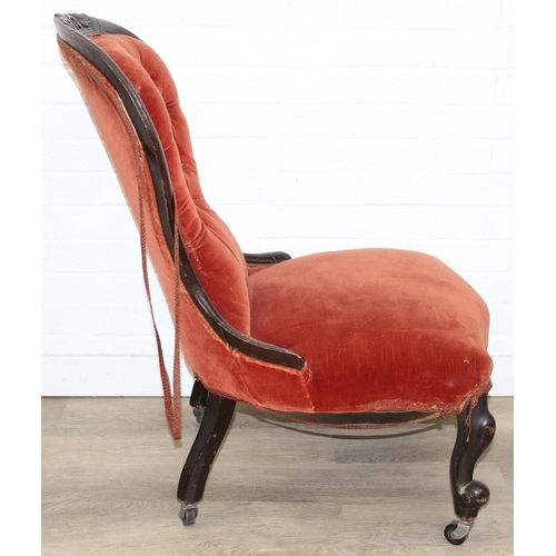 74 - A 19th century low chair with shaped button back and exposed carved frame, 87cm tall