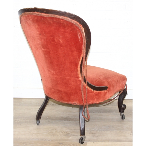 74 - A 19th century low chair with shaped button back and exposed carved frame, 87cm tall