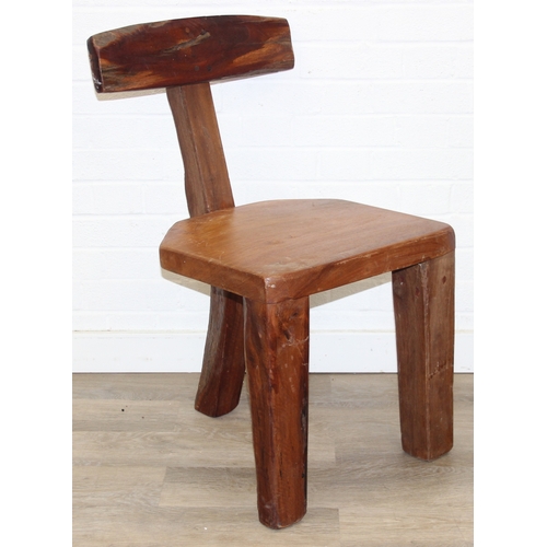 23 - In the manner of Olavi Hänninen (1920-1992), a set of four heavy wooden chairs with T shaped backs a... 
