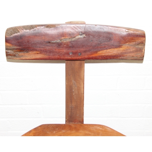 23 - In the manner of Olavi Hänninen (1920-1992), a set of four heavy wooden chairs with T shaped backs a... 