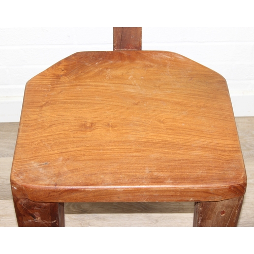 23 - In the manner of Olavi Hänninen (1920-1992), a set of four heavy wooden chairs with T shaped backs a... 