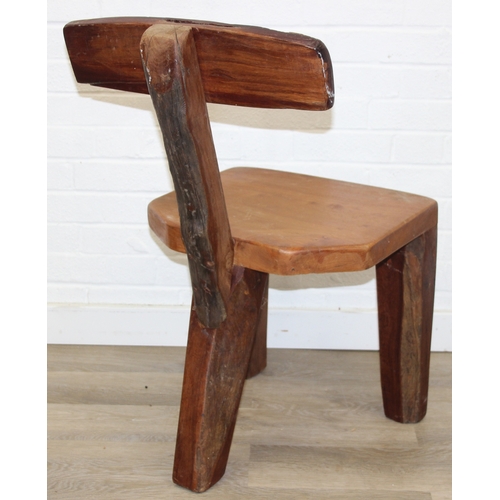 23 - In the manner of Olavi Hänninen (1920-1992), a set of four heavy wooden chairs with T shaped backs a... 