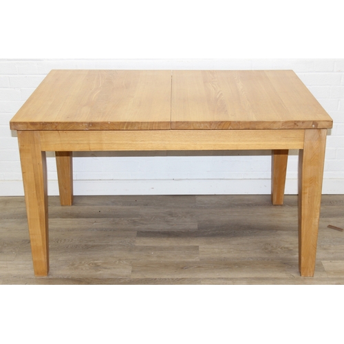 73 - A modern light oak extending dining table with single extra leaf, 133cm extending to 169cm x 92cm x ... 