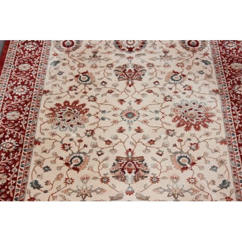 201 - A large John Lewis rug, Royal Heritage Mahal design in ivory and rust colouring, wool, original RRP ... 
