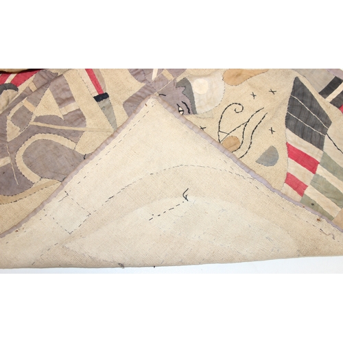 206 - A vintage Egyptian Revival needlework or appliqué panel depicting Egyptian motifs, likely early to m... 