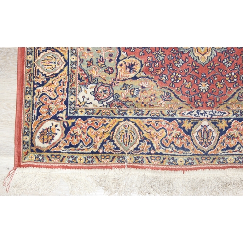 208 - A vintage Heriz style rug of red ground, 150cm x 100cm