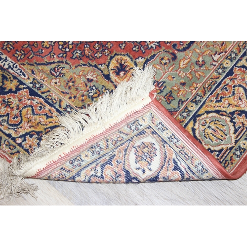 208 - A vintage Heriz style rug of red ground, 150cm x 100cm