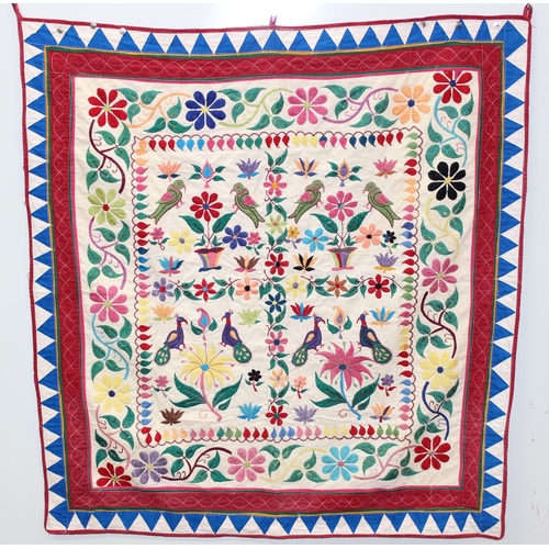209 - A vintage Indian Toran or Kutch style embroidered wall hanging decorated with colourful flowers and ... 
