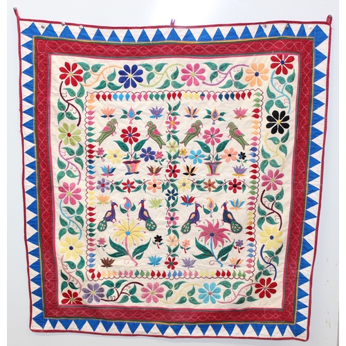 209 - A vintage Indian Toran or Kutch style embroidered wall hanging decorated with colourful flowers and ... 