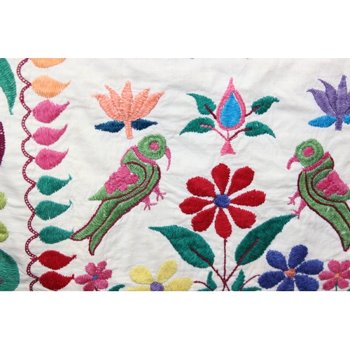 209 - A vintage Indian Toran or Kutch style embroidered wall hanging decorated with colourful flowers and ... 