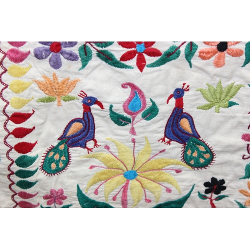 209 - A vintage Indian Toran or Kutch style embroidered wall hanging decorated with colourful flowers and ... 