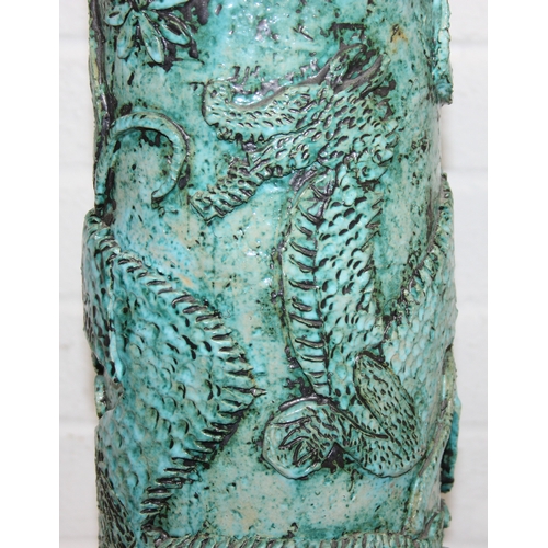 281 - An unusual studio pottery jardinière stand, decorated with dragon and flowers with turquoise glaze, ... 