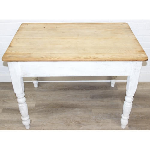 51 - An antique pine farmhouse table with distressed white painted base and turned legs, 106cm x 72cm x 7... 