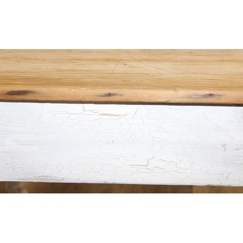 51 - An antique pine farmhouse table with distressed white painted base and turned legs, 106cm x 72cm x 7... 