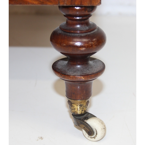 30 - A 19th century walnut Canterbury or magazine rack with single drawer, turned supports and brass and ... 