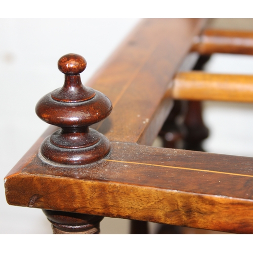 30 - A 19th century walnut Canterbury or magazine rack with single drawer, turned supports and brass and ... 