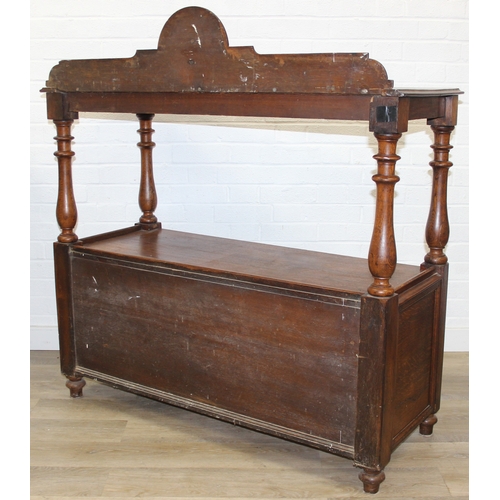 75 - An antique oak two tier buffet stand with cupboard base and carved frieze to top, late 19th or early... 