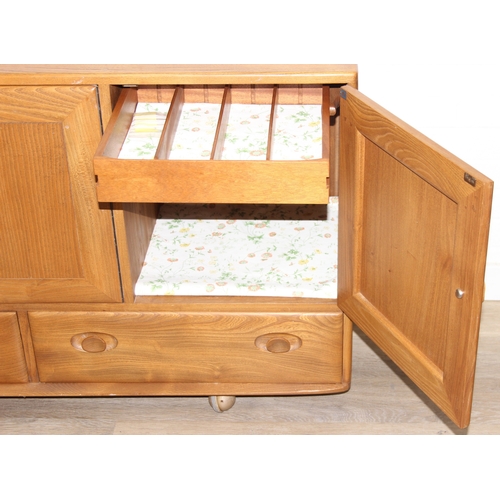 1 - A retro Ercol Windsor model 468 sideboard, three cupboards over two drawers, blonde finish, 128cm x ... 