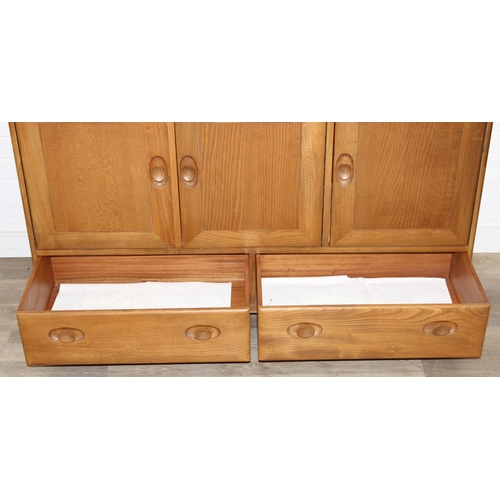 1 - A retro Ercol Windsor model 468 sideboard, three cupboards over two drawers, blonde finish, 128cm x ... 