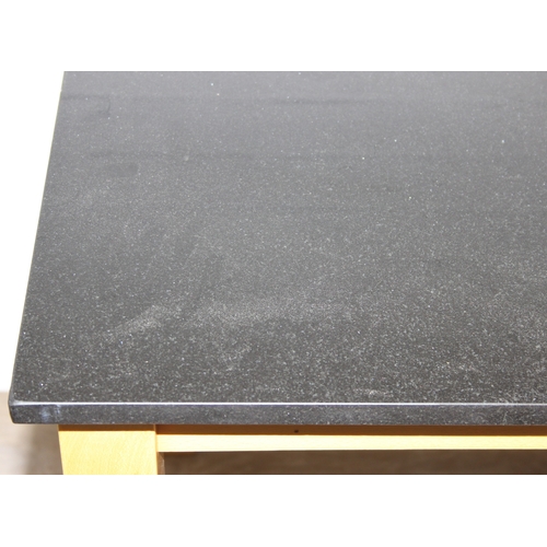 13 - A modern dining table with black slate top and two chairs, light oak finish, 110cm x 70cm x 75cm