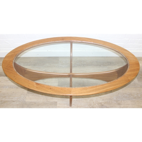 26 - A retro G-Plan oval topped coffee table with glass inset top, 123cm x 66cm x 42cm