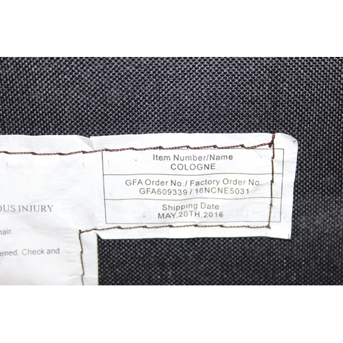 11 - An Ekornes style brown leather reclining armchair with matching footstool, splayed base, 76cm wide x... 