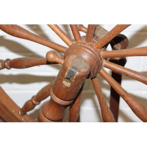53 - James Williamson (believed to be for Timbertops Thurmaston), a vintage oak or elm spinning wheel, st... 