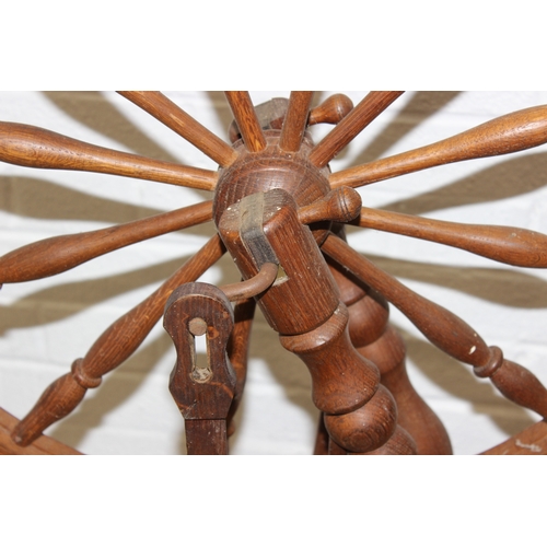 53 - James Williamson (believed to be for Timbertops Thurmaston), a vintage oak or elm spinning wheel, st... 