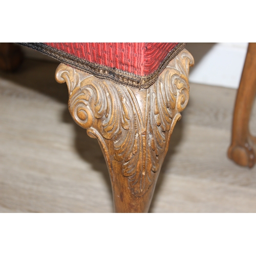 70 - A vintage stool with cabriole legs and ball and claw feet, red upholstered top, 63cm x 47cm x 50cm