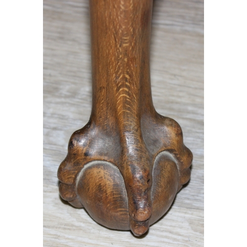 70 - A vintage stool with cabriole legs and ball and claw feet, red upholstered top, 63cm x 47cm x 50cm