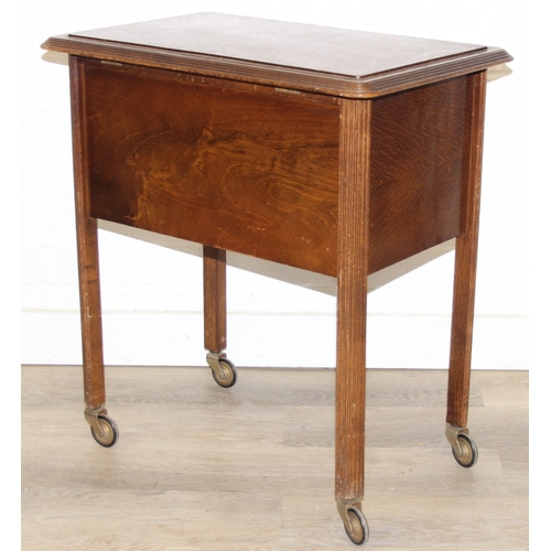 109 - A vintage oak sewing box on wheels with vintage contents inc cotton reels, 56cm x 37cm x 62cm