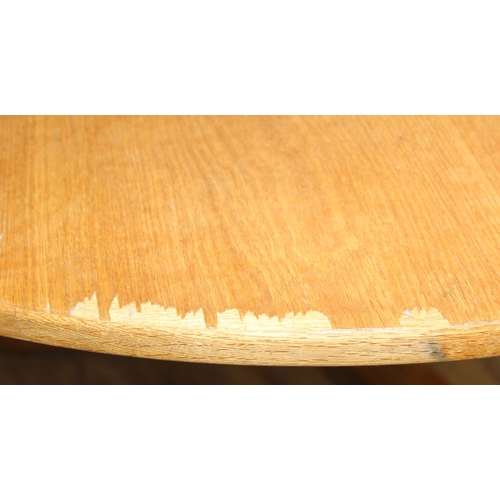 99 - A modern light oak dining table with pillar support and tripod base, 124cm in diameter x 71cm tall