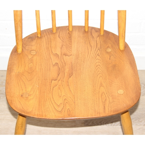 24 - A set of four Ercol Quaker high hoop back dining chairs, blonde finish, gold label, each 96cm tall