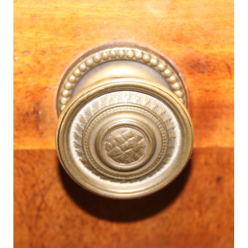 183 - A Victorian mahogany rolltop desk with fitted interior above a cupboard, plinth base, brass mounts, ... 