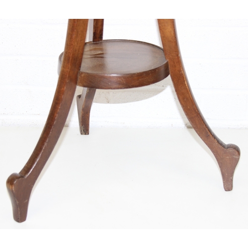 192 - An unusual vintage mahogany 3-legged jardinière stand with carved details, 115cm