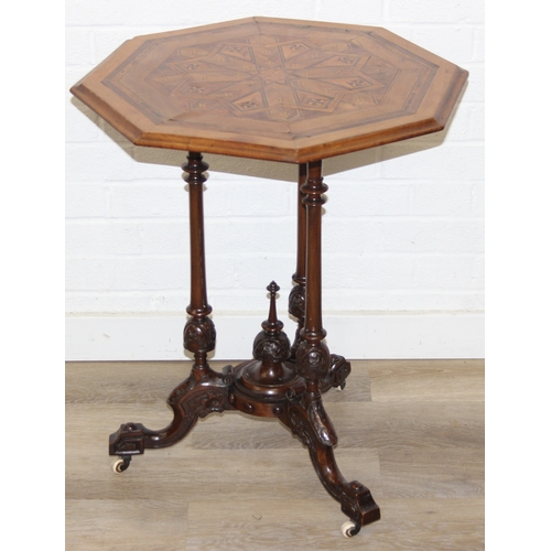 108 - An antique specimen wood parquetry inlaid octagonal topped table with intricately carved triple pill... 