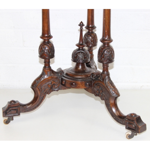 108 - An antique specimen wood parquetry inlaid octagonal topped table with intricately carved triple pill... 