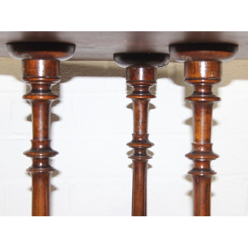 108 - An antique specimen wood parquetry inlaid octagonal topped table with intricately carved triple pill... 