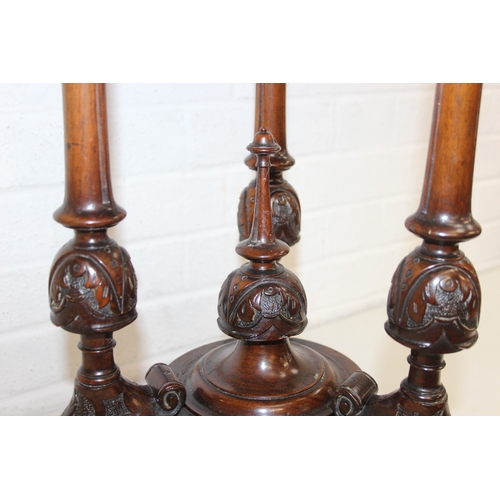 108 - An antique specimen wood parquetry inlaid octagonal topped table with intricately carved triple pill... 