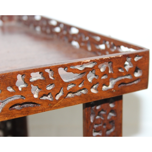 193 - A vintage Chinese Chippendale style mahogany side table with pierced gallery and supports, 20th cent... 