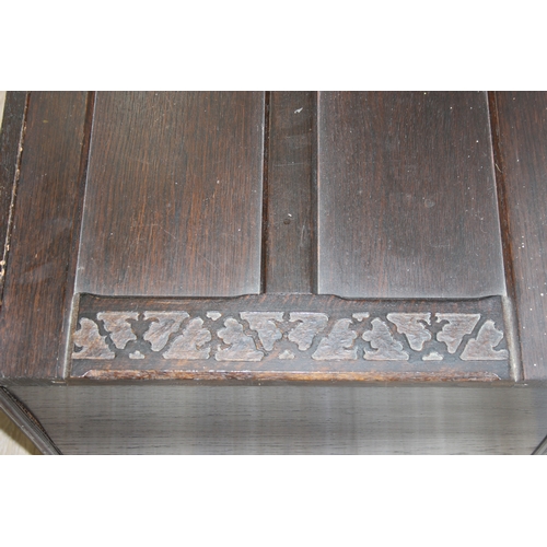 112 - An unusual dark oak trunk of ottoman box, Gothic style with linen press drawers to interior, 102cm x... 