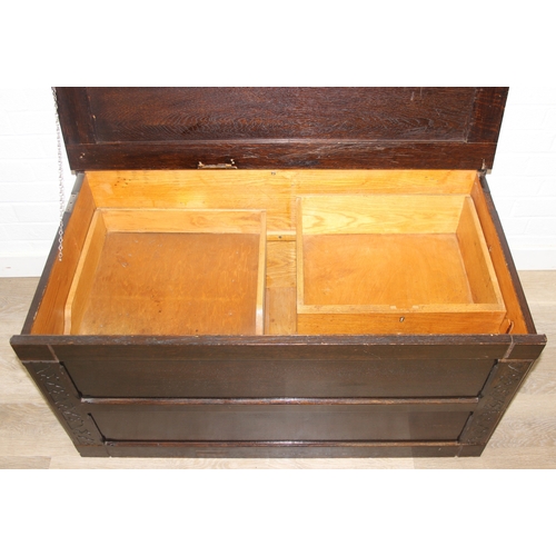 112 - An unusual dark oak trunk of ottoman box, Gothic style with linen press drawers to interior, 102cm x... 