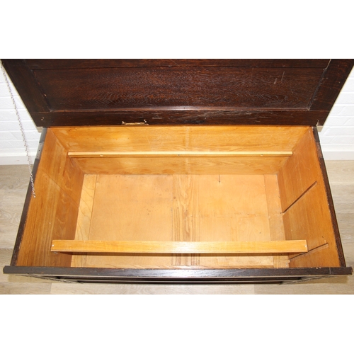 112 - An unusual dark oak trunk of ottoman box, Gothic style with linen press drawers to interior, 102cm x... 