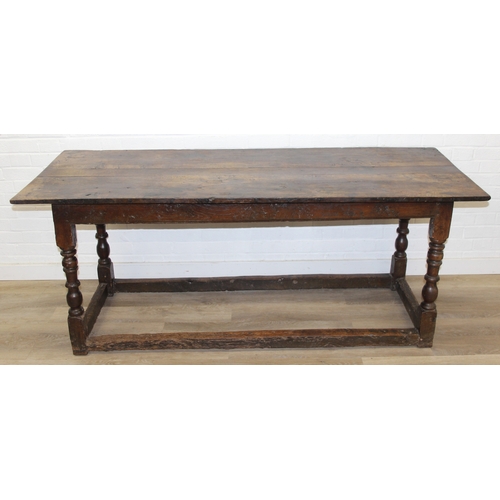 5 - A 17th century and later oak refectory table with turned legs and stretchers, the base likely 17th c... 