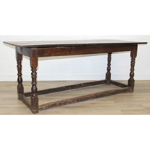 5 - A 17th century and later oak refectory table with turned legs and stretchers, the base likely 17th c... 