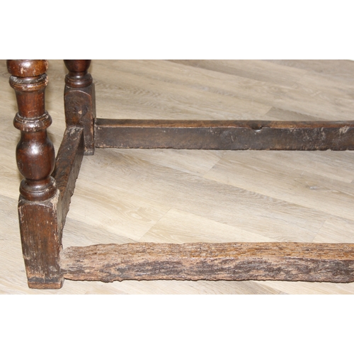 5 - A 17th century and later oak refectory table with turned legs and stretchers, the base likely 17th c... 