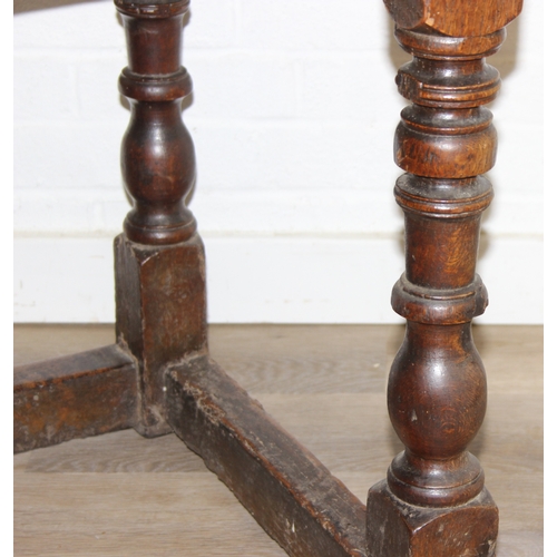5 - A 17th century and later oak refectory table with turned legs and stretchers, the base likely 17th c... 