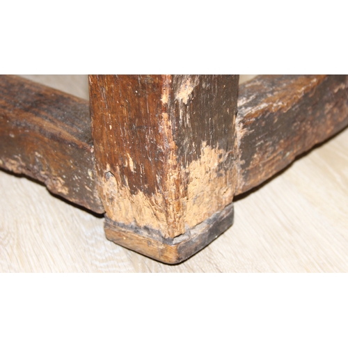 5 - A 17th century and later oak refectory table with turned legs and stretchers, the base likely 17th c... 